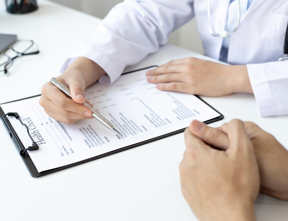 Pharmacist consulting patient